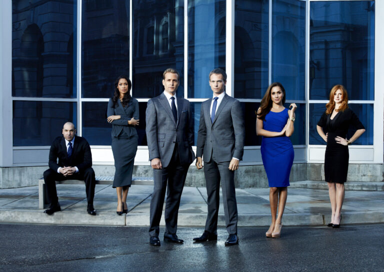 SUITS -- Season: 2 -- Pictured: (l-r) Rick Hoffman as Louis Litt, Gina Torres as Jessica Pearson, Gabriel Macht as Harvey Specter, Patrick J. Adams as Mike Ross, Meghan Markle as Rachel Zane, Sarah Rafferty as Donna -- Photo by: Robert Ascroft/USA Network