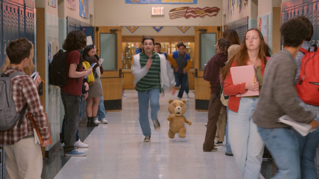 TED -- Pictured: (l-r) Max Burkholder as John, Seth MacFarlane as voice of Ted -- (Photo by: Peacock)