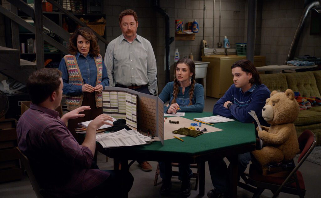 TED -- Pictured: (l-r) Alanna Ubach as Susan, Scott Grimes as Matty, Giorgia Whigham as Blaire, Max Burkholder as John, Seth MacFarlane as voice of Ted -- (Photo by: Peacock)