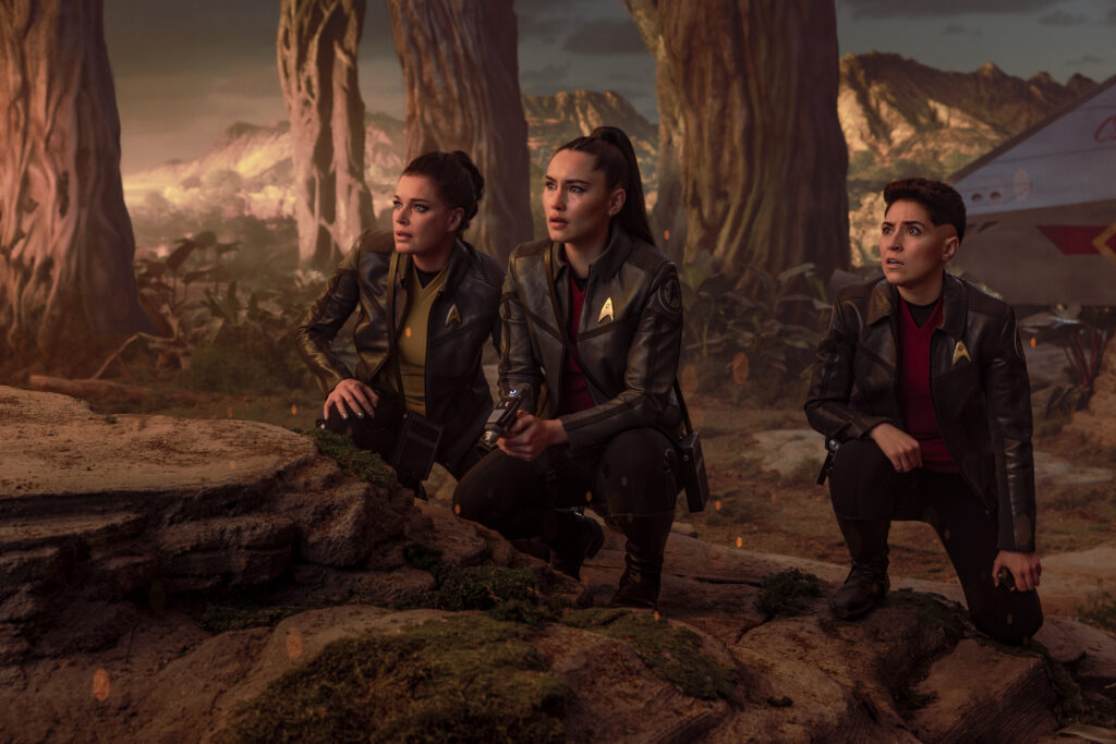 (L-R): Rebecca Romijn as Una, Christina Chong as La’an Noonien-Singh, and Melissa Navia as Erica Ortegas in season 4, episode 1, of Star Trek: Strange New Worlds streaming on Paramount+, 2026. Photo Credit: Jan Thijs/Paramount+